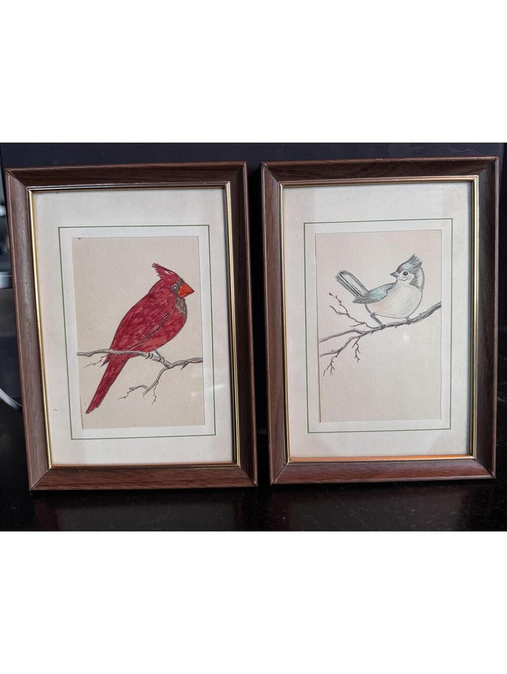 Vintage bird art prints featuring a cardinal and a blue jay in frames
